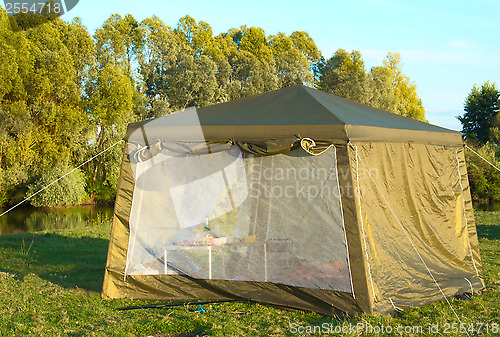 Image of A big tourist tent on the Bank of the river.