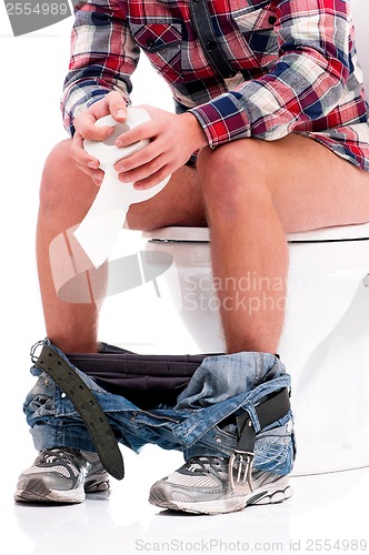 Image of Man on toilet bowl