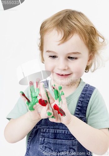 Image of cute little girl with finger paint