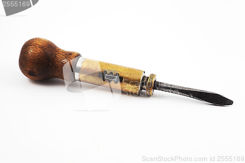 Image of vintage old screwdriver with a mechanism