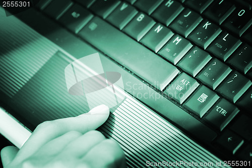 Image of Working at laptop .