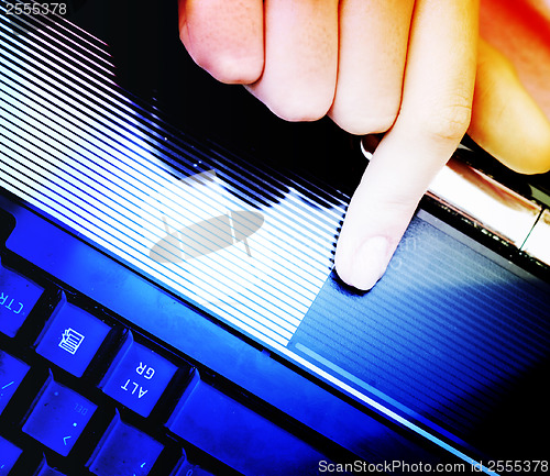 Image of Working at laptop .