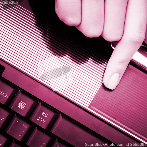 Image of Working at laptop .