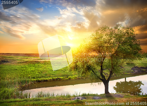 Image of Sunset over spring river