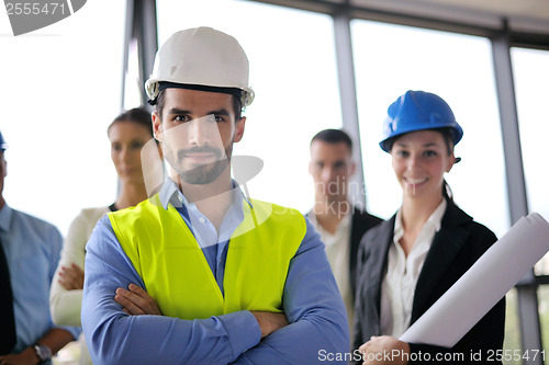 Image of business people and construction engineers on meeting