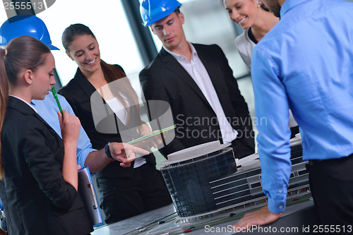 Image of business people and construction engineers on meeting