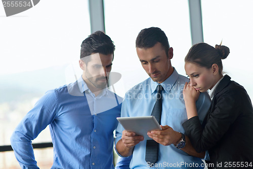 Image of business man using tablet compuer at office