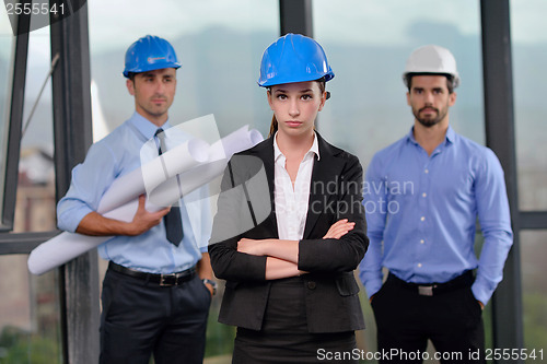 Image of business people and construction engineers on meeting