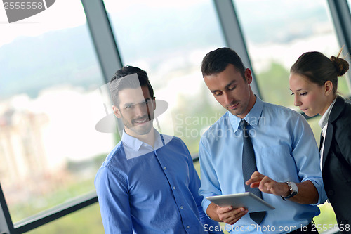 Image of business man using tablet compuer at office