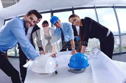 Image of business people and construction engineers on meeting