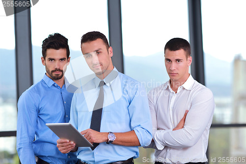 Image of business man using tablet compuer at office