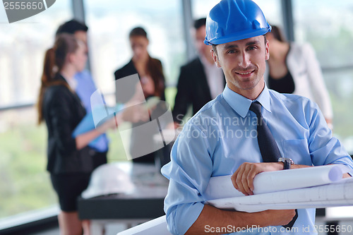 Image of business people and construction engineers on meeting