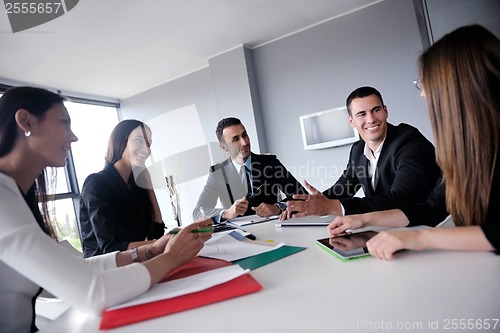 Image of business people group in a meeting at office