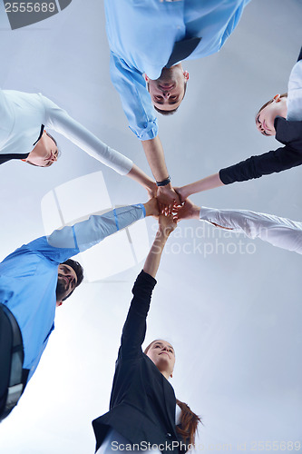 Image of business people group joining hands