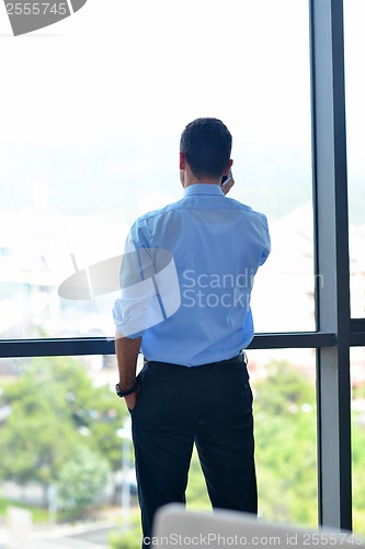 Image of business man talking by cellphone