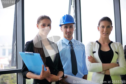 Image of business people and construction engineers on meeting