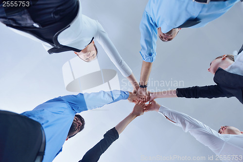 Image of business people group joining hands