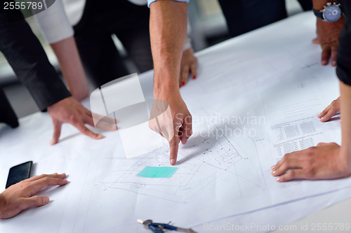 Image of business people and construction engineers on meeting