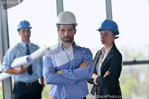 Image of business people and construction engineers on meeting