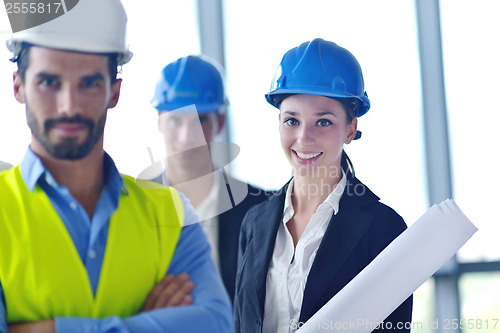 Image of business people and construction engineers on meeting