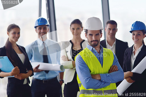 Image of business people and construction engineers on meeting