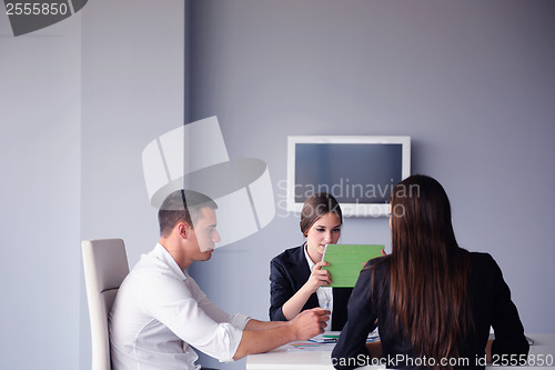 Image of business people group in a meeting at office