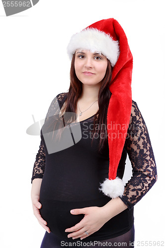 Image of beautiful pregnant woman tenderly holding her tummy isolated on white background