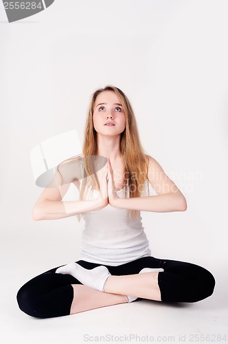 Image of Pretty girl doing meditation exercise
