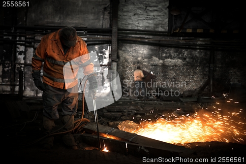 Image of Welding manwith sparks