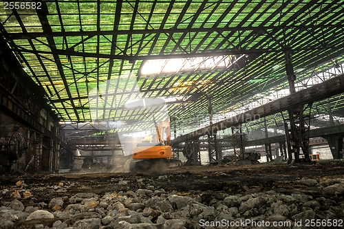 Image of Industrial interior with bulldozer inside