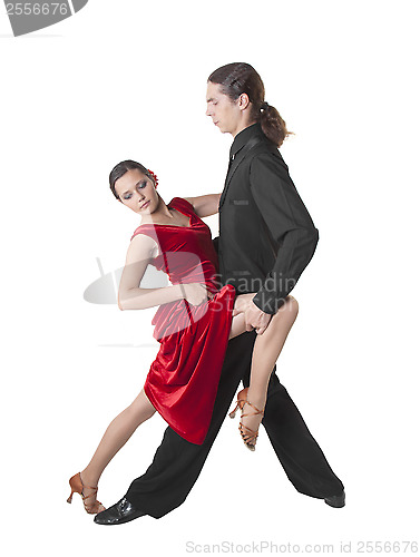 Image of Young couple dancing tango