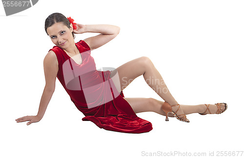 Image of Beautiful woman sitting on the floor