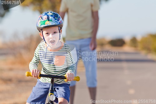 Image of little boy biking