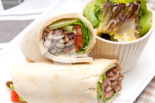 Image of kafta shawarma chicken pita wrap roll sandwich