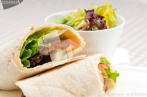 Image of kafta shawarma chicken pita wrap roll sandwich