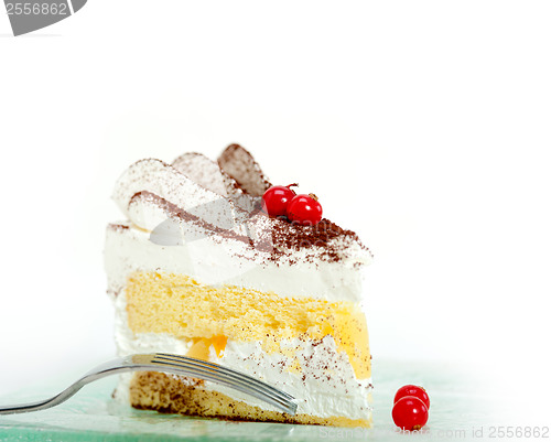 Image of whipped cream and ribes dessert cake slice