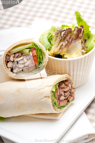 Image of kafta shawarma chicken pita wrap roll sandwich