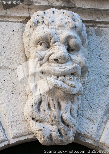 Image of ugly man bas-relief stone face