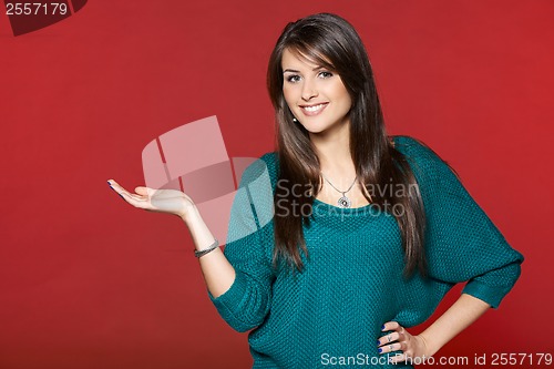 Image of Woman in warm clothes showing blank copy space