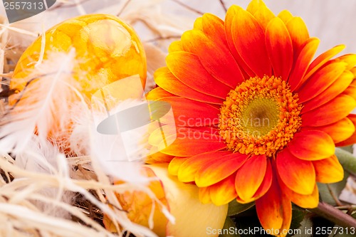 Image of Vivid orange Easter egg with a gerbera and rose