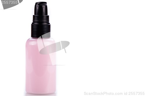 Image of pink plastic bottle of cosmetic cream isolated on white