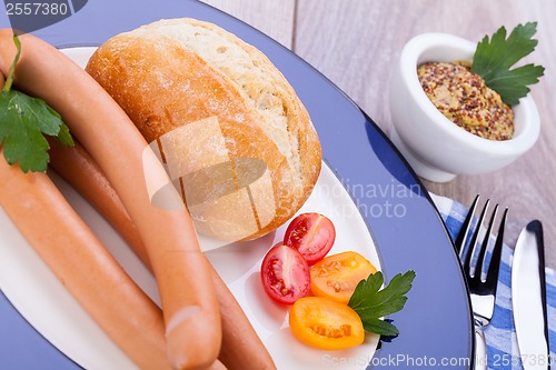 Image of tasty sausages frankfurter with grain bread 