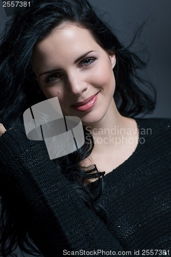 Image of Dark moody portrait of a brunette beauty