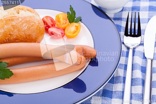 Image of tasty sausages frankfurter with grain bread 