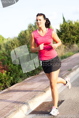 Image of Caucasian woman practicing jogging in the park