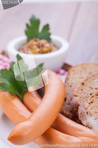 Image of tasty sausages frankfurter with grain bread 