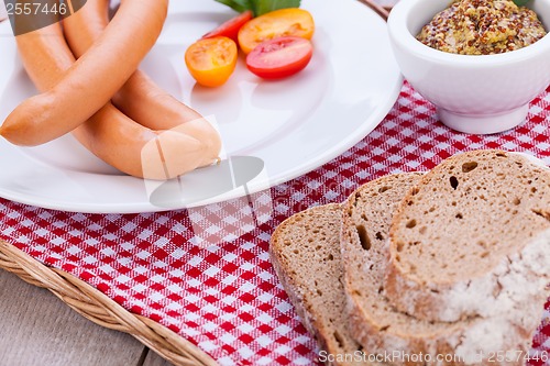 Image of tasty sausages frankfurter with grain bread 