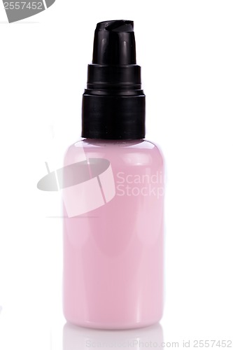 Image of pink plastic bottle of cosmetic cream isolated on white