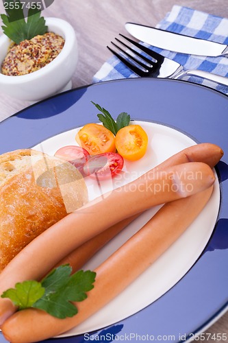 Image of tasty sausages frankfurter with grain bread 