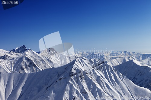 Image of Snowy rocks in nice sun day, view from ski slope